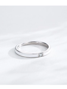 Detailed macro view of S925 sterling silver ring with white enamel and central zircon stone