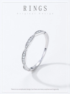 Close-up of S925 sterling silver ring featuring a clear hallmark and micro-pave cubic zirconia