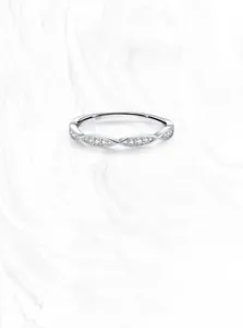 Macro shot of S925 sterling silver ring showing intricate pavé-set crystals and hallmark