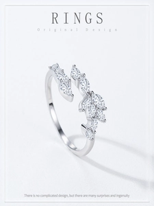 Detailed macro of S925 silver leaf ring featuring marquise-cut stones and open design