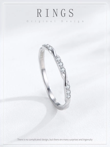 Detailed view of S925 sterling silver twisted rope ring with sparkling pavé zircons