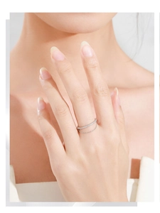 Detailed view of S925 sterling silver double-layered ring with crystals and a fine chain