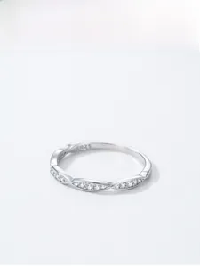 Macro view of S925 sterling silver wavy ring featuring sparkling pavé zircon stones