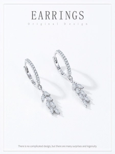 Detailed view of S925 sterling silver hoop earrings with zircon-set leaf pendants