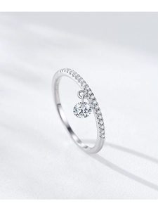 Close-up of S925 sterling silver ring with pavé diamonds and a round solitaire pendant