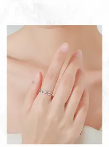 Detail of S925 sterling silver double-layer ring with square zircon on model's hand