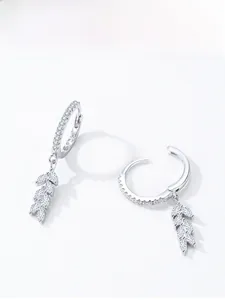 Macro shot of S925 sterling silver leaf earrings with sparkling white zircon stones