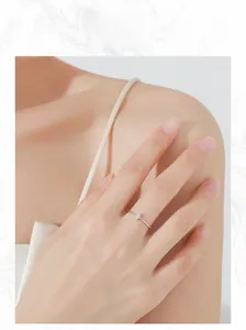 Marquise cut diamond on minimalist S925 sterling silver ring worn by a model