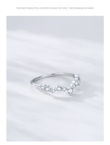 Macro shot of S925 sterling silver V-shaped wave ring featuring brilliant zircon stones