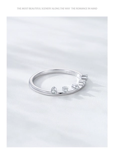 Macro shot of S925 sterling silver ring featuring a crown design and engraved hallmark