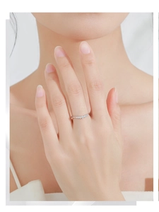 Detailed view of slender S925 silver ring featuring seven micro-pave zircons for stacking