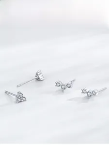Detail view of S925 sterling silver mini stud earrings with sparkling cubic zirconia clusters