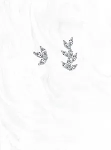 Macro shot of silver olive leaf stud earrings with marquise-cut clear zirconia stones