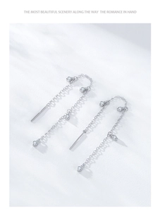 Detail of S925 sterling silver tassel chain earrings featuring sparkling zircon accents