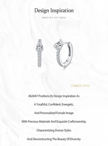 Détail des boucles d'oreilles créoles en argent S925 avec zircons en forme de poire