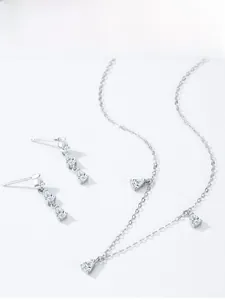 Macro shot of S925 sterling silver water drop jewelry set with sparkling zircon stones