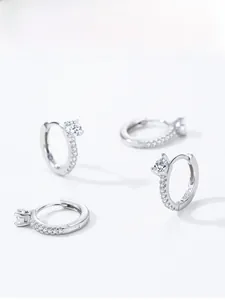 Macro shot of S925 sterling silver hoop earrings with white zircon accents and S925 hallmark