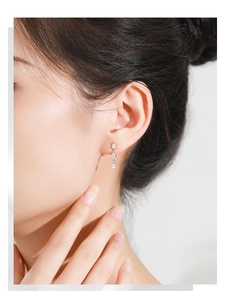 Detailed view of S925 sterling silver drop earrings with three tiered sparkling zircons