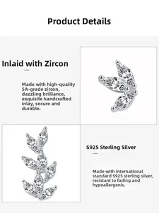 Macro detail of asymmetric leaf silver stud earrings with 5A marquise-cut zircons