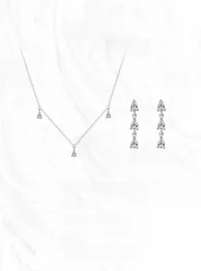 Detail of S925 sterling silver drop jewelry set with sparkling zircon in a macro view