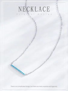 Detail view of S925 sterling silver bar necklace with pavé set turquoise stones on O-chain