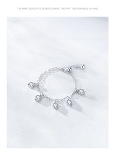 Detail of adjustable S925 silver chain ring with five hanging round cubic zirconia stones
