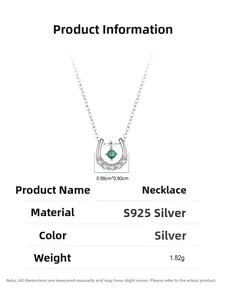 Detail view of S925 silver horseshoe necklace with green gemstone and small diamonds