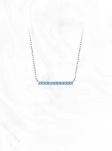 Detailed close-up of a horizontal bar pendant set with small round turquoise stones on S925 silver