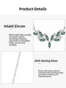 Detail of S925 silver olive branch necklace with green cubic zirconia and dainty chain