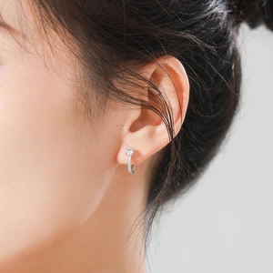 S925 sterling silver hoop earrings with round zircon stones worn by a model
