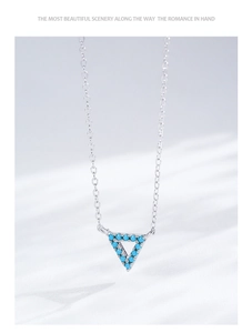 Detail of S925 sterling silver necklace featuring a turquoise inlay triangle pendant