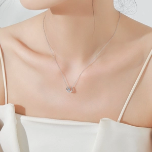 Elegant S925 sterling silver horseshoe necklace with blue zircon on model collarbone