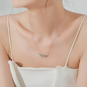 Elegant S925 sterling silver olive branch necklace with green marquise stones on model