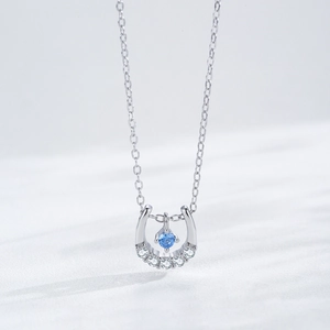 S925 sterling silver horseshoe necklace with a central dancing blue zircon stone
