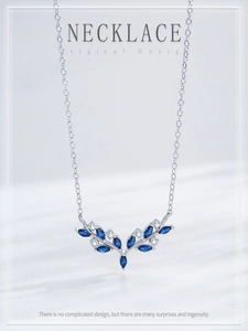 Macro detail of S925 silver antler necklace with dark blue marquise cut gemstones