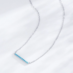 Minimalist S925 sterling silver bar necklace with turquoise stones on white background