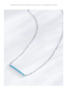 Close-up of S925 sterling silver bar necklace with turquoise gemstone inlay