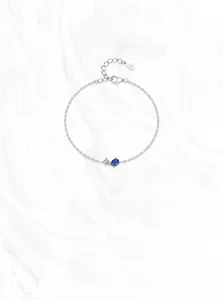 Detailed macro of S925 sterling silver bracelet featuring pear and oval cut gemstones