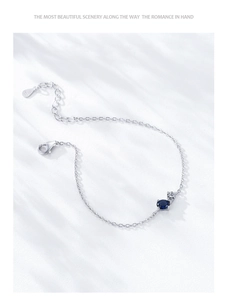 Detail of S925 sterling silver bracelet with dark blue stone and lobster clasp
