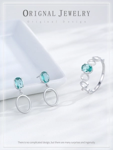 Close-up of S925 sterling silver stamp and oval blue gemstones on jewelry set