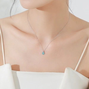 Elegant S925 sterling silver waterdrop turquoise pendant necklace worn by a model