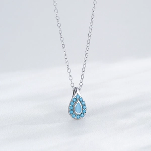 S925 silver necklace with teardrop turquoise pendant surrounded by blue crystals