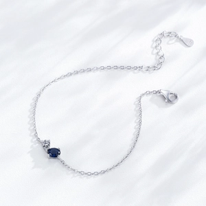 Elegant S925 sterling silver chain bracelet with dark blue sapphire and clear cubic zirconia