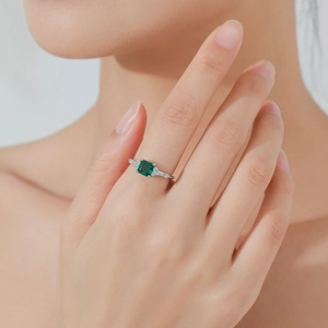 Elegant S925 silver ring featuring a square emerald gemstone worn on a model hand