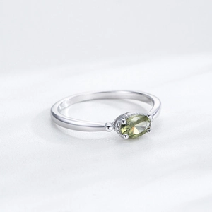Elegant S925 sterling silver ring with oval olive green gemstone in a four-claw setting