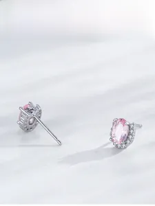 Detail of S925 silver stud earrings featuring oval pink morganite with a diamond halo