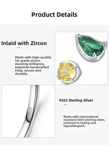 Detail of S925 sterling silver ring with pear-cut green and round yellow zircons
