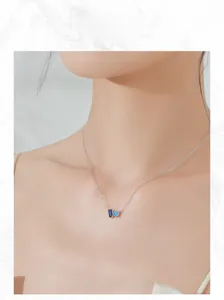 Close-up of S925 silver necklace with rectangular dark blue and round sky blue zircons