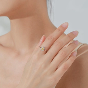 Elegant S925 sterling silver ring with halo pear cut yellow diamond on model hand