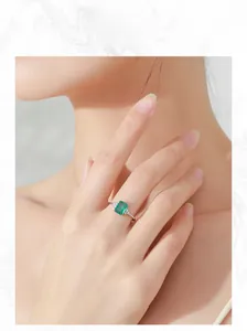 Detailed view of an S925 silver ring featuring a rectangular emerald-cut green gemstone